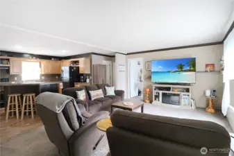 Wide open and full of light make this living, kitchen, and dining space perfect for gathering with family and friends.