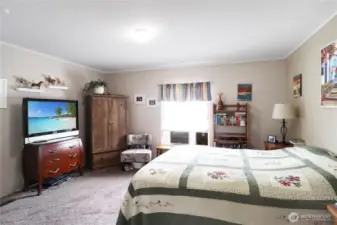 Large walk-in closet offering abundant hanging space and shelving to keep everything organized.