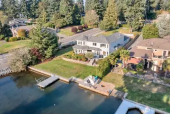 Enjoy breathtaking views of Mt. Rainier and Lake Tapps, plus easy access to the water with steps leading right down to the shoreline. After a swim or paddle, rinse off in the mud room’s walk-in shower before gathering on the patio or relaxing in the hot tub.