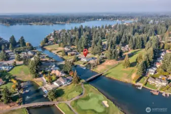 Beyond your doorstep, the community offers resort-style amenities including private roads, 24/7 security, pool, beaches, boat launch, tennis and pickleball courts, and an outer island nature trail.
