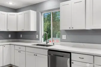 Plenty of counterspace to plan great meals and still see outside to the deck and yard.