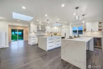 Skylights and even a work or fitness space adjacent to the designer kitchen