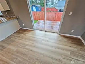 Sliders open from the dining area to the BBQ deck.