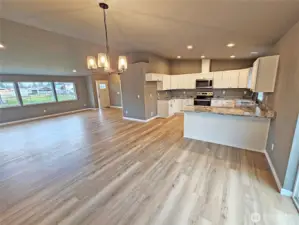 kitchen open to the great room. Durable, EZ clean vinyl plank flooring