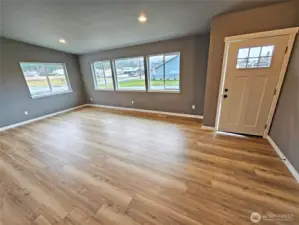 Super spacious great room with lots of picture windows for natural light. Wallspace ideal for a huge flatscreen TV