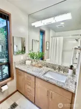 Full guest bathroom at lower level.