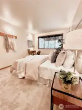 Elegant guest bedroom at lower level.