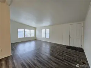 Spacious living room with plenty of room to relax, arrange multiple seating areas, and entertain with ease.