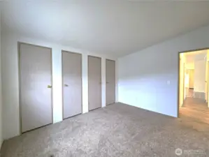 Wall of closets providing abundant storage with room to personalize.