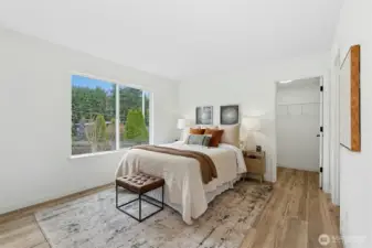 Main level bedroom with attached bathroom