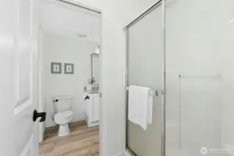 Main level bath that opens to the bedroom and hall