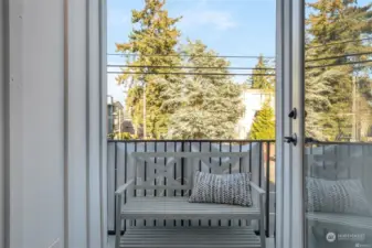 Spacious balcony overlooks the community green space
