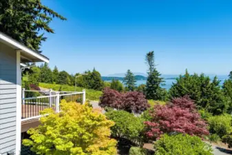 Mature landscaping and large deck for enjoying water & mountain views views