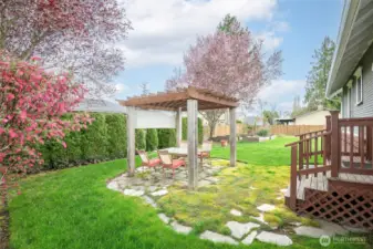 Fully fenced rear and side yard, mature landscaping complete with cobble stone walkways and gazebo.