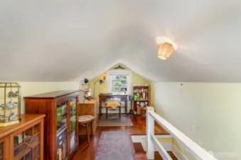 The upstairs landing offers a versatile space—ideal for a home office, cozy reading nook, or fun play area.
