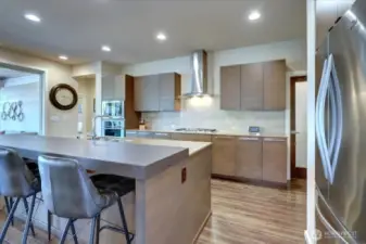 Modern kitchen with stainless steel appliances.