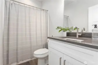 Full Bathroom with quartz countertops.