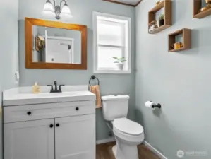 Downstairs half bathroom centrally located.