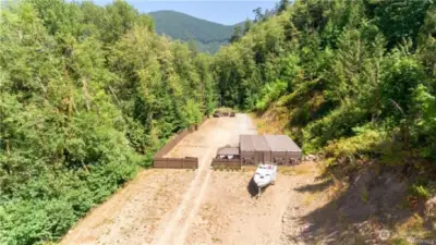 drone photo of parcel before fence and connex building was removed. Lot line is fence line and beyond.