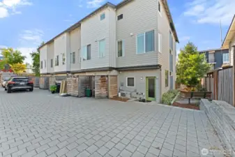 Back of home with parking area