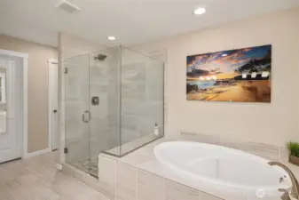 primary bedroom attached bath - note that the seamless glass shower is fully tiled. There is also a linen closet in the bath - there are actually 4 linen closets on the upper floor