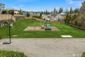 Avery Pointe features a neighborhood park with basketball court, playground and large grassy spaces for play.