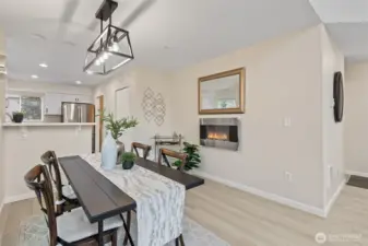 Nice electric fireplace and dining table set go with the house.