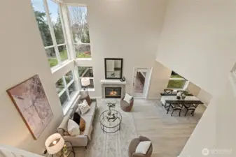 Two story height ceiling with wall windows that fill the living room w/ tons natural light.
