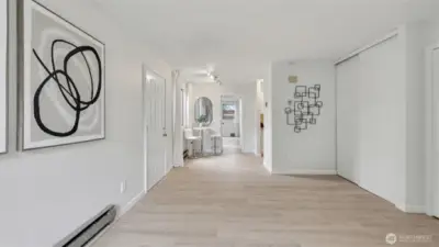 Living room is bright and open to kitchen and dining area. Two closets for extra storage with a side door and path leading to the back yard.