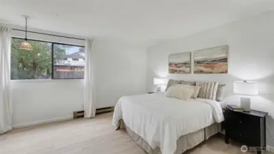 Huge bedroom includes a walk-in closet and room for home office or hobby desk.