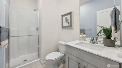 Bathroom down features walk-in shower. Guests never have to go usptairs. Pictures are for representational purposes only, colors and features may vary.