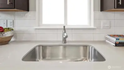 Kitchen sink NOT in the island. Pictures are for representational purposes only, colors and features may vary.