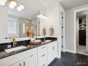 Primary bath has many upgrades for you to enjoy.  Full length mirror, titled shower floor, and an extra large custom closet.