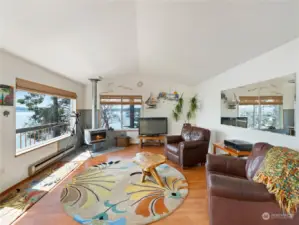 Good sized living room with walls of windows looking south and west. Watch the Guemes ferry come and go, plus all of the other boat traffic. Passive solar even in winter means you rarely need the electric heat.