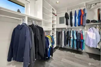 Spacious walk-in closet with built-ins.