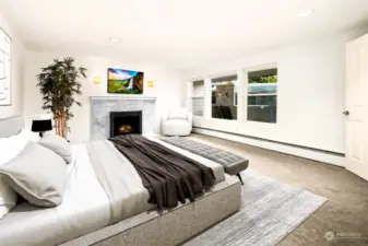 The lower level offers a spacious south facing bedroom with fireplace and views out to a private patio with access to the rear yard and is serviced by a full bath and second laundry/ gym or storage area.