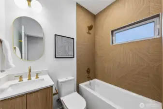 This full bathroom is on the lower and entry level. It would service the on bedroom there and any guests.