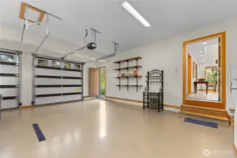 Large garage with floor drain.