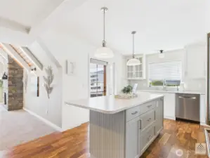 This open-concept kitchen flows seamlessly into the family room, allowing everyone to gather and stay connected whether you're cooking or relaxing.