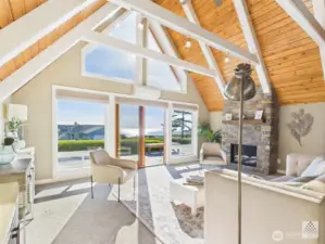 Soaring ceilings and a custom gas fireplace provide the perfect setting to relax and soak in the stunning views.
