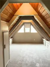 Light filled upstairs 3rd bedroom with original built-ins for extra storage.