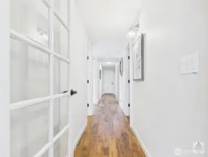 Beautiful hardwood floors line the main-floor hallway, which effortlessly connects the garage, bedrooms, bathroom, office and kitchen for easy everyday living.
