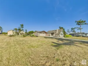 In addition to the ample space, the double lot includes a charming garden area and a custom-built shed that seamlessly connects and enhances the overall layout of the yard.