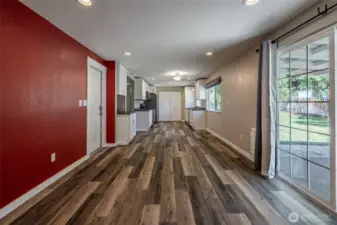 family room with sliding door to backyard