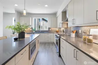 Plenty of counter top space and cabinetry.
