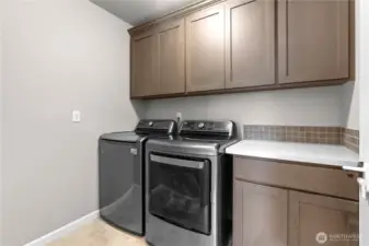 2nd floor utility room with upgraded cabinets