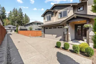 Front of the home shows the gated private driveway
