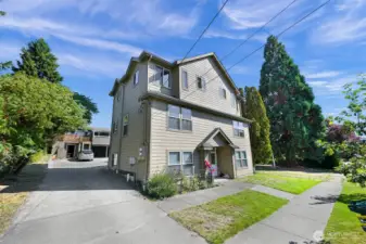 The house sits at the back of the property with the duplex at the street