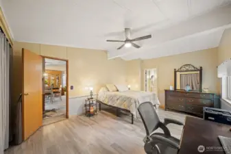 The oversized primary bedroom boasts vaulted ceilings and sits on its own side of the house!