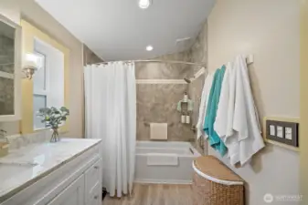 Primary bathroom with updated vanity to include a granite counter top!
